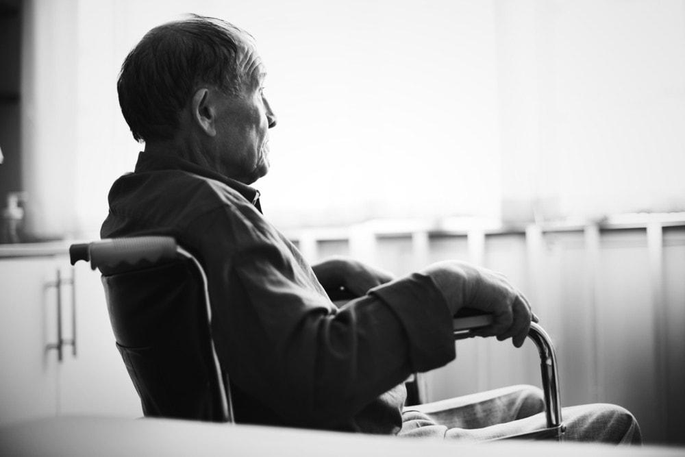 Lawyer in Chicago reviewing a nursing home abuse case with concerned family members.
 